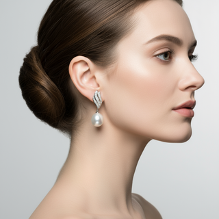 Woman wearing a pearl earring with a gray background