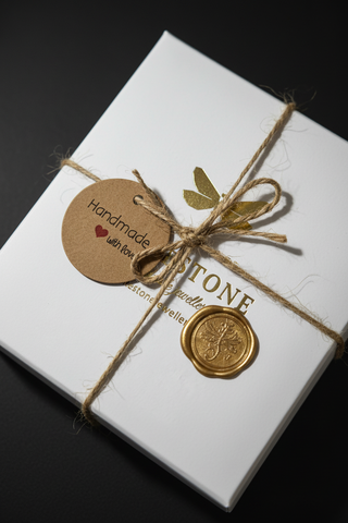 Jewelry tag with 'Handmade with Love' on a white background