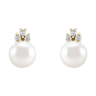 Gold stud earrings with round white pearls and three accent diamonds each