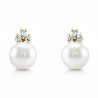 Pearl earrings with gold and diamond accents on a white background