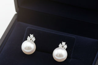 5mm white pearl stud earrings with small diamond accents on white gold posts