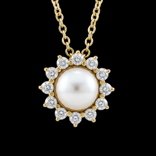 A gold pendant necklace featuring a large white pearl surrounded by a halo of round diamonds, suspended from a gold chain against a solid black background.