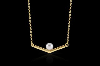 Gold necklace with a single pearl pendant on a white background