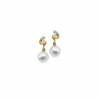 Gold and pearl earrings on a white background