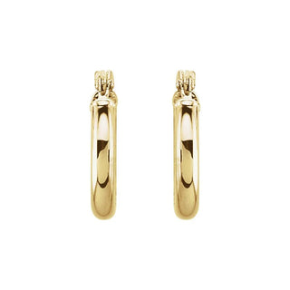 Gold hoop earrings on a white background