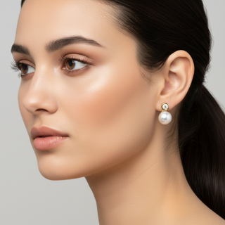 Close-up of a woman wearing Akoya pearl &Diamond earrings against a neutral background- Whitestone Jewellery