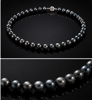A double-image product shot of a black pearl necklace on a glossy grey background. The top image shows the full necklace with a silver-toned beaded clasp, and the bottom image is a close-up detail of the glossy grey pearls.