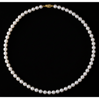 A classic akoya pearl necklace with uniform white pearls and a gold clasp, displayed on a solid black background.