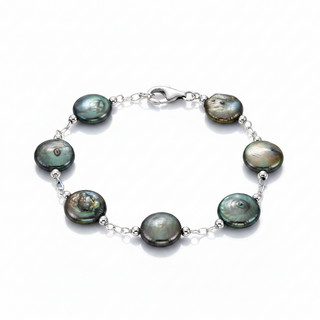 A silver chain bracelet featuring seven irregular, iridescent green-blue freshwater pearls, displayed on a clean white background.