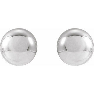 Pair of white gold round earrings on a white background