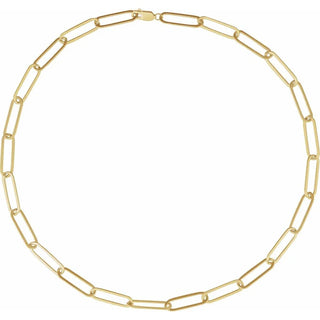 Gold paperclip chain necklace with elongated links on a white background