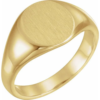 Gold signet ring on a white background