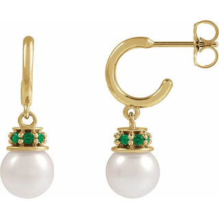 Gold half hoop earrings with round white pearls and green garnet accents