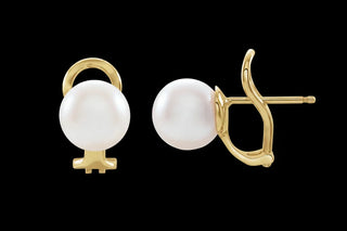 Pearl earrings with gold clasps on a white background